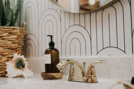 a bathroom sink with a mirror above it