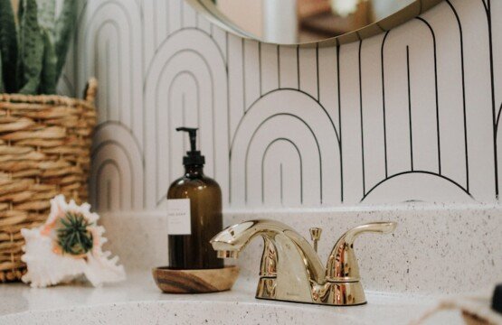 a bathroom sink with a mirror above it